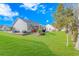 Spacious backyard with lush lawn and retaining wall at 451 Cypress View Ave., Little River, SC 29566