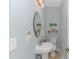 Small half bathroom with white pedestal sink and beachy decor at 451 Cypress View Ave., Little River, SC 29566