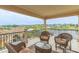 Relaxing balcony with wicker seating offering scenic views of the waterfront community at 5208 Nightingale Dr., Myrtle Beach, SC 29577