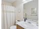 Bright bathroom features a white vanity, updated mirror, and decorative accents at 6706 Bryant St. # B, Myrtle Beach, SC 29572