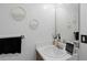 Bathroom features a clean white vanity, a stylish mirror, and decorative wall hangings at 6706 Bryant St. # B, Myrtle Beach, SC 29572