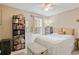 Cozy bedroom with a ceiling fan, natural light, and neutral decor, ideal for relaxation at 6706 Bryant St. # B, Myrtle Beach, SC 29572