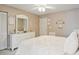 Bright bedroom featuring white dresser, neutral walls, and white door at 6706 Bryant St. # B, Myrtle Beach, SC 29572