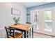 Cozy dining area with natural lighting and view of the backyard, perfect for Gathering meals at 6706 Bryant St. # B, Myrtle Beach, SC 29572