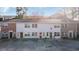 Exterior view of townhouse featuring a brick accent, a communal parking lot, and inviting front entrances at 6706 Bryant St. # B, Myrtle Beach, SC 29572