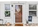 Charming entrance featuring a glass door with welcome wreath, complemented by decorative plants and ample natural light at 6706 Bryant St. # B, Myrtle Beach, SC 29572