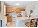 Efficient kitchen with wood cabinetry, granite countertops, and modern appliances at 6706 Bryant St. # B, Myrtle Beach, SC 29572