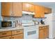 Well-equipped kitchen with modern appliances, ample counter space, and warm wood cabinetry at 6706 Bryant St. # B, Myrtle Beach, SC 29572