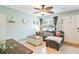 Comfortable living room with stylish furniture, a large window, and charming decor at 6706 Bryant St. # B, Myrtle Beach, SC 29572