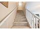 Carpeted staircase leading to the upper level, providing a comfortable transition between floors at 6706 Bryant St. # B, Myrtle Beach, SC 29572