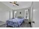 Relaxing bedroom featuring a ceiling fan, bright windows, and closet space at 859 Tall Oaks Ct. # A, Myrtle Beach, SC 29588
