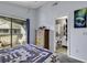 Serene bedroom featuring balcony access and an ensuite bathroom, providing convenience and comfort at 859 Tall Oaks Ct. # A, Myrtle Beach, SC 29588