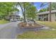 Charming Tall Oaks Court community entrance featuring well-manicured landscaping and inviting residential buildings at 859 Tall Oaks Ct. # A, Myrtle Beach, SC 29588