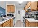 Well-lit kitchen featuring updated appliances, wood cabinets, and a practical layout at 859 Tall Oaks Ct. # A, Myrtle Beach, SC 29588