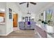Open living room with lots of natural light, access to the patio, and hardwood floors at 859 Tall Oaks Ct. # A, Myrtle Beach, SC 29588