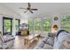 Comfortable living area with a ceiling fan, hardwood floors, and access to the outdoors at 859 Tall Oaks Ct. # A, Myrtle Beach, SC 29588