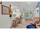 Bright living space with dining area, hardwood floors, and a view of the trees outside at 859 Tall Oaks Ct. # A, Myrtle Beach, SC 29588