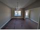 Elegant dining room with large window and chandelier at Tbd 18 Casey Dr., Nichols, SC 29581