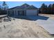 Newly constructed home with gray siding, attached garage, and a spacious driveway at Tbd 18 Casey Dr., Nichols, SC 29581