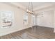 Dining area with wood-look floors and chandelier at 101 Bantry Ln., Conway, SC 29526