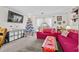 Living room features a Christmas tree and red couches at 1025 Carolina Rd. # Z4, Conway, SC 29526