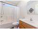 Bathroom featuring shower and tub combo, white vanity, and a decorative mirror at 1049 Augustus Dr., Conway, SC 29527