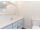 Bright bathroom with a modern vanity, mirror, and toilet at 1049 Augustus Dr., Conway, SC 29527