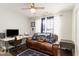 Comfortable bedroom with a leather couch, desk, and ceiling fan at 1049 Augustus Dr., Conway, SC 29527