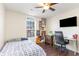 Cozy bedroom featuring a bed, desk and mounted TV at 1049 Augustus Dr., Conway, SC 29527