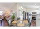 Bright dining area with views to the kitchen, connecting modern design and open living at 1049 Augustus Dr., Conway, SC 29527