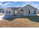 Charming single-story home with a well-maintained lawn and inviting entryway at 1049 Augustus Dr., Conway, SC 29527