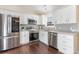 Modern kitchen with stainless steel appliances, granite countertops, and ample cabinet space at 1049 Augustus Dr., Conway, SC 29527