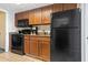 Full kitchen with black appliances and wood cabinets at 1105 S Ocean Blvd. # 620, Myrtle Beach, SC 29577