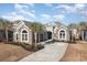 Two-story house with driveway and palm trees at 1113 Bluffton Ct., Myrtle Beach, SC 29579