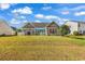 House with a large backyard and a beautiful lawn at 130 Balsa Dr., Longs, SC 29568