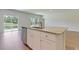 Kitchen island with granite countertop and stainless steel dishwasher at 1387 Palm Springs Paloma Dr, Longs, SC 29568