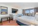 Bright bedroom with a comfortable bed, large TV, and ocean view at 1501 S Ocean Blvd. # 909, Myrtle Beach, SC 29577