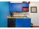 Blue kitchenette with microwave, coffee maker, and mini-fridge at 1501 S Ocean Blvd. # 909, Myrtle Beach, SC 29577