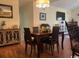 Bright dining room featuring a wood table and four chairs at 208 Rose Water Loop, Myrtle Beach, SC 29588