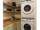 Laundry room with stackable washer and dryer and extra shelving at 208 Rose Water Loop, Myrtle Beach, SC 29588