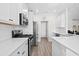 Bright kitchen featuring white cabinets and stainless steel appliances at 219 Lakota Loop, Longs, SC 29568