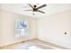 Well-lit bedroom featuring a large window and ceiling fan at 2409 Causey Dr., North Myrtle Beach, SC 29582