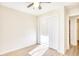 Light bedroom with ceiling fan and louvered closet doors at 2409 Causey Dr., North Myrtle Beach, SC 29582