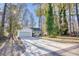 Newly renovated house with a long driveway and mature trees in front at 2409 Causey Dr., North Myrtle Beach, SC 29582