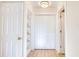 White hallway with built-in shelving and louvered doors at 2409 Causey Dr., North Myrtle Beach, SC 29582