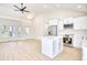 Bright kitchen with white cabinets, stainless steel appliances, and an island at 2409 Causey Dr., North Myrtle Beach, SC 29582