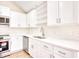 Modern white kitchen with stainless steel appliances at 2409 Causey Dr., North Myrtle Beach, SC 29582