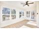 Sunroom with hardwood floors, ceiling fan and access to backyard at 2409 Causey Dr., North Myrtle Beach, SC 29582