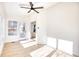 Sunroom with hardwood floors, ceiling fan and multiple windows at 2409 Causey Dr., North Myrtle Beach, SC 29582