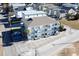 Aerial view of a three-story building with parking and surrounding houses at 300 47Th Ave. S # 1C, North Myrtle Beach, SC 29582